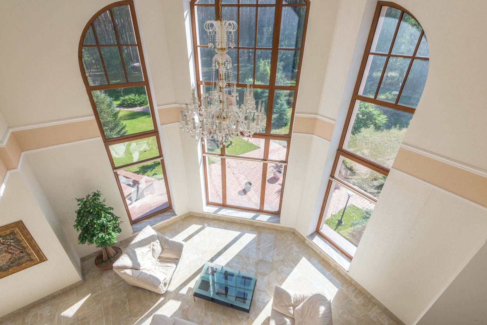 Bright empty room with large windows and a timber ceiling