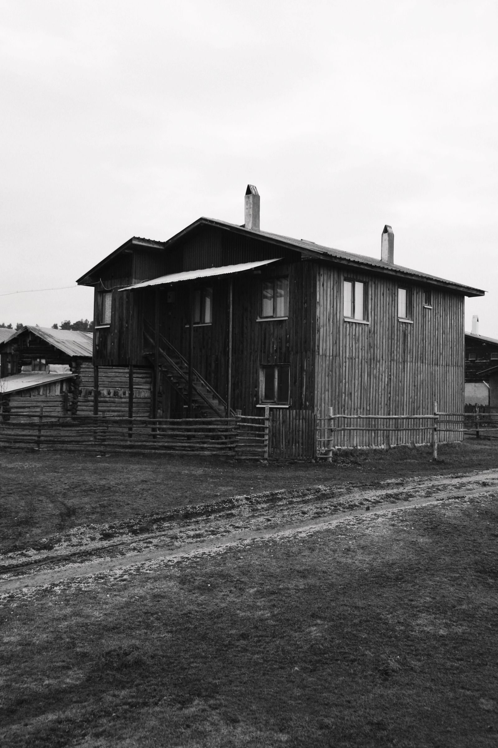 Weathered wooden outbuilding with aging board siding